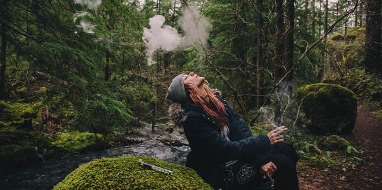 woman smoking in the woods
