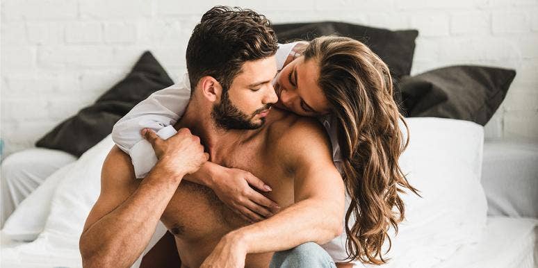 The #1 Phrase Men Hate To Hear The Most man and woman embracing on bed