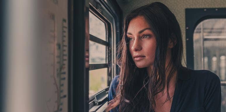 He Doesn't Owe You Closure After A Breakup — It's Not Real upset woman looking out a window