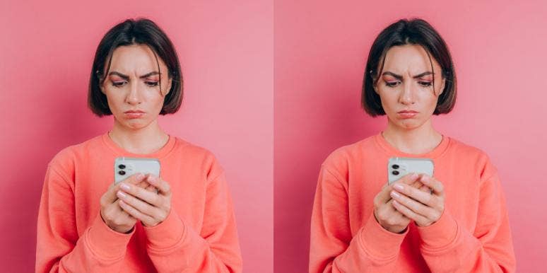Reasons Why Men Text You But Never Ask You Out woman in monochrome pink looking at phone