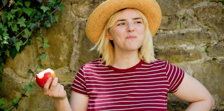 10 Healthy Foods That Make You Happy And Boost Your Mood woman eating apple