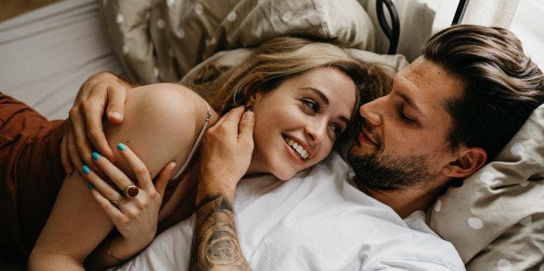healthy relationship communication skills man and woman cuddling in bed