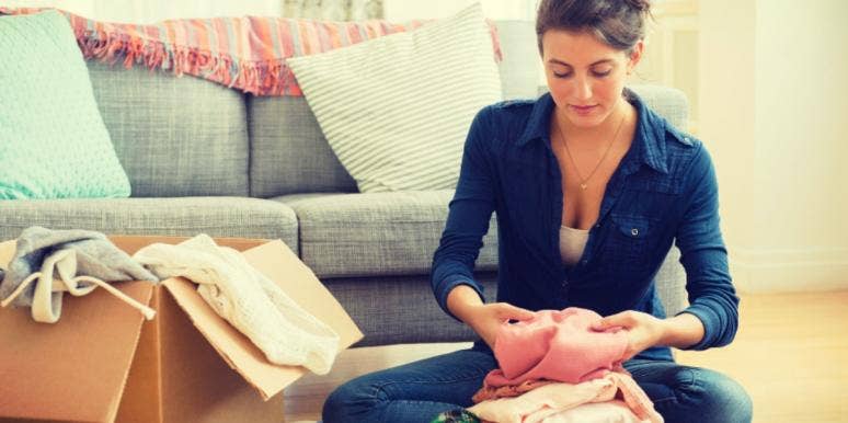How To Help A Loved One Who’s Hoarding woman decluttering hoarding