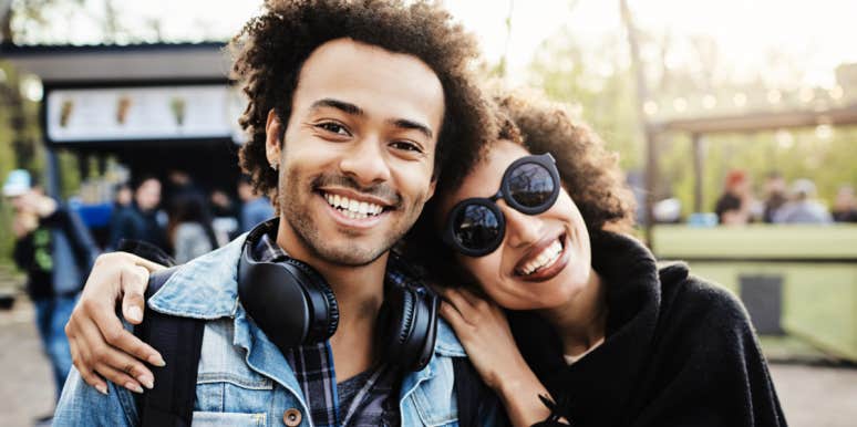 hero of dysfunctional family siblings embrace out on a street