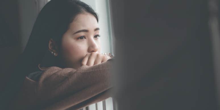 Why It Isn't Always The Guy's Fault Your Heart Is Broken woman looking out a window