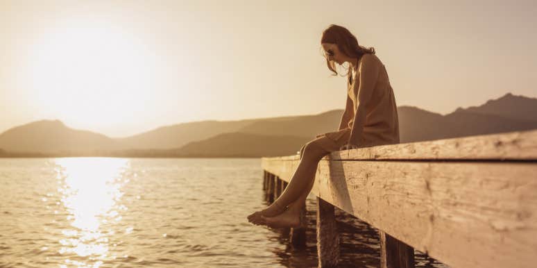 Hitting Rock Bottom Is the Best Thing That Ever Happened To Me woman sitting on pier by water