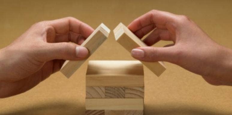 divorce couples hands building blocks house