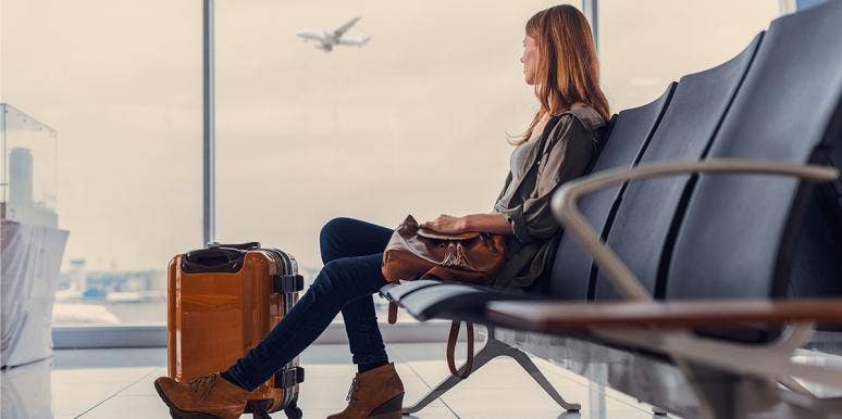 Why I Took My Honeymoon By Myself woman sitting at airport