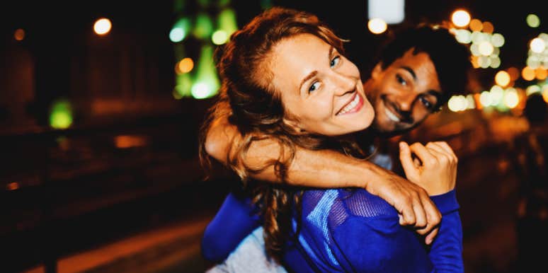 How To Stop Hooking Up When You're Drunk woman smiling at camera, man pulling her along, laugging