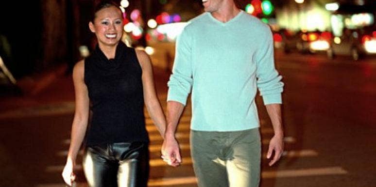 Don't ruin your next date! young attractive couple holding hands across street