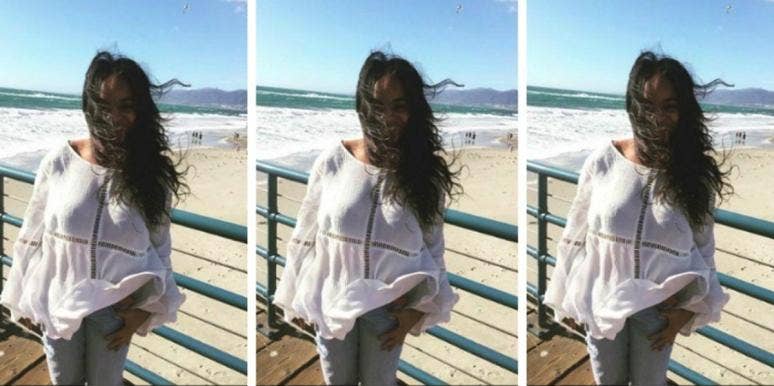 How Being Laid Off Gave Me The Most Millennial Mindset Ever woman on beach with hair blowing in the wind