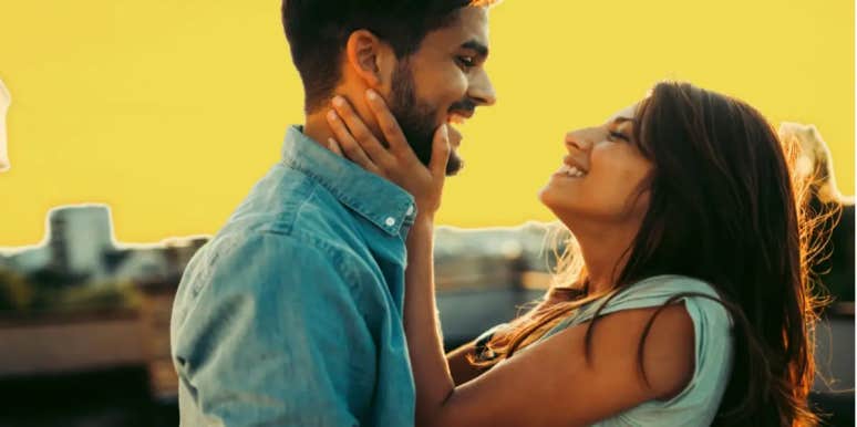 How To Fall Back In Love With Your Partner (Because Yes, You Can) girlfriend grabbing boyfriend's face and smiling