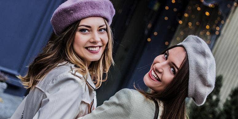 women smiling in berets