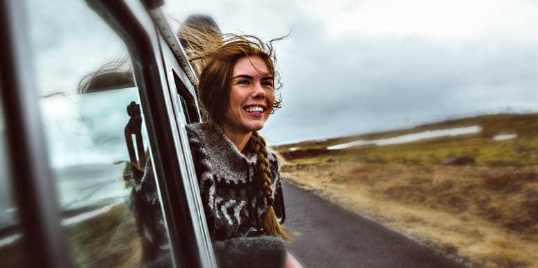 The alternate PTSD treatment that healed me woman, smiling, hanging out of a car window in the high desert