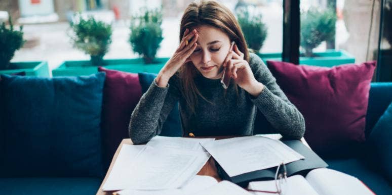 Personality Test: How Likely You Are To Get Fired woman stressed with work papers