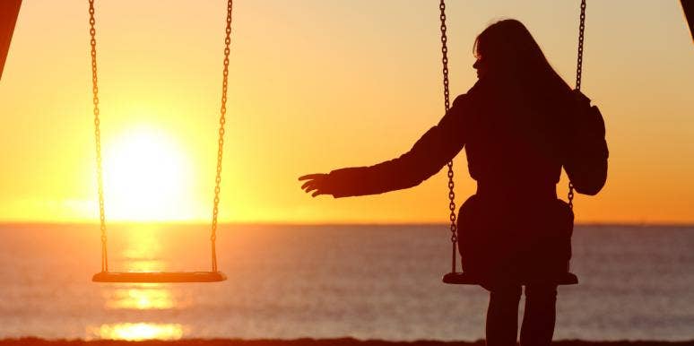 How to Honor Your Grief and Take Time to Mourn, According To An Expert woman mourning a loved ne