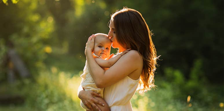 Having A Baby Destroyed My Relationship With My Best Friend mom kissing baby