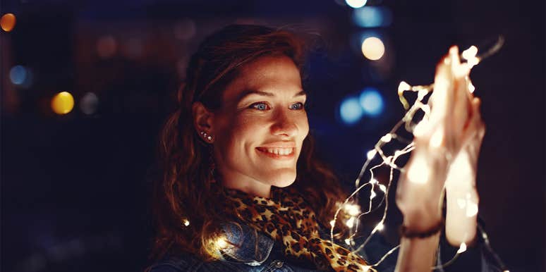 7 Things You Must Do To Make Your Own Luck & Get What You Want woman with strings of light