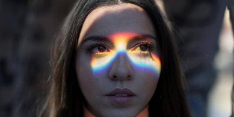 woman with rainbow over her eyes