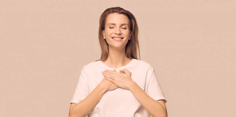 How My Child Accidentally Taught Me To Lighten Up woman holding hands against her heart