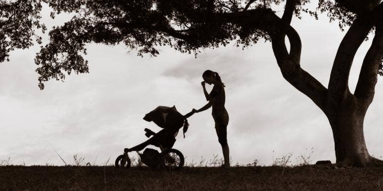 How Postpartum Depression Made Me A Better Mother sad mother with baby in stroller