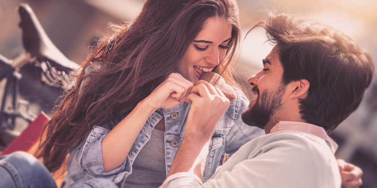How To Avoid Drama In A Relationship & Be Less Dramatic couple smiling eating cookie