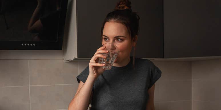 How To Get Rid Of Hiccups Fast: Remedies, Causes & Prevention woman drinking water