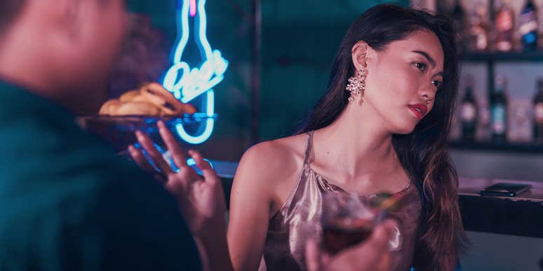 The Simplest Way To Tell She's Not Into You woman rejecting man at bar