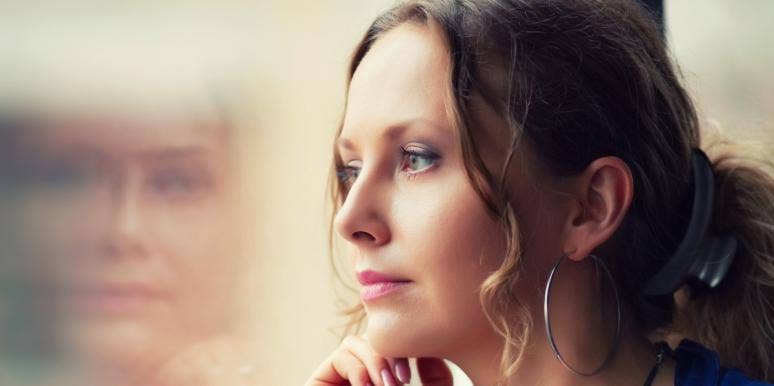 how to apologize for ghosting someone sad woman looking out the window