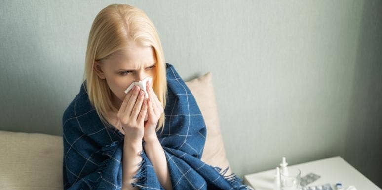 How To Avoid Keto Flu: 6 Ways To Curb The Negative Symptoms & Side Effects Of Keto Dieting woman blowing her nose