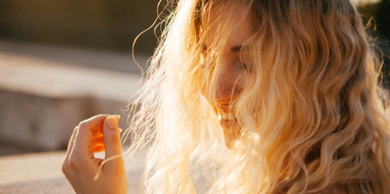 blonde woman with sun hitting her hair
