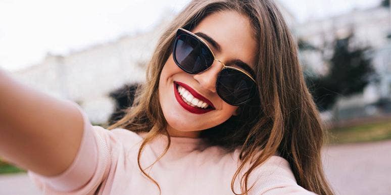 woman with sunglasses smiling
