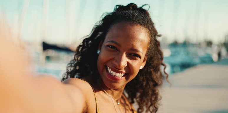 11 Simple-Yet-Powerful Changes That Set You Up For The Happiest Life Ever smiling woman taking selfie