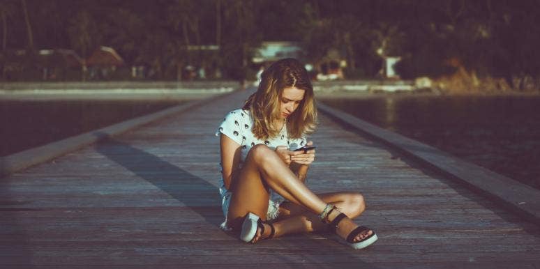 How To Break Up With A Girl Over Text Without Being A Jerk girl sitting on the ground texting