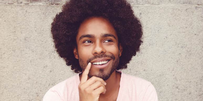 How To Change Someone's Mind Quickly, According To Science man smiling thinking
