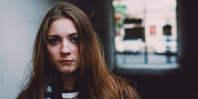 how to cope with disappointment sad woman standing in hallway