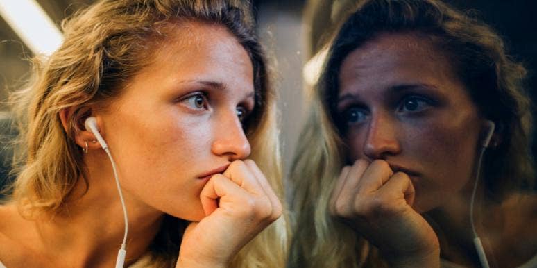 How To Deal With Guilt woman looking out window at her reflection