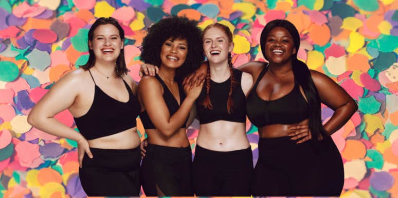 4 women feeling confident about their bodies standing in front of a colorful background