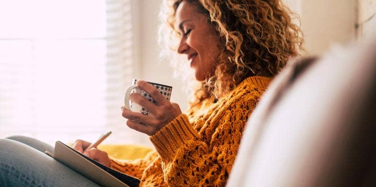 how to find a new normal smiling woman writing and having coffee