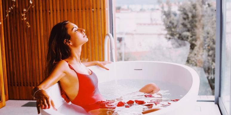 how to get back on your feet woman relaxing in a tub