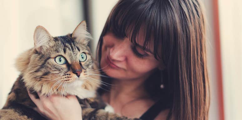 How To Get A Cat To Like You In 5 Steps woman holding cat