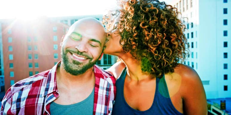 How To Get A Guy To Talk About His Feeeeelings woman sitting next to man and kissing his forehead