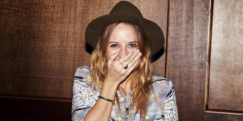 how to get over embarrassment embarrassed woman laughing