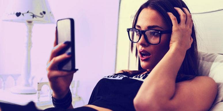 How To Get Someone To Stop Texting You: Error Text Message woman looking at phone because she can't get someone to stop texting
