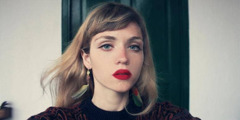 contemplative woman wearing red lipstick