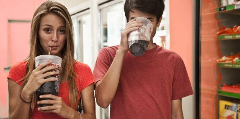 How To Take Your Power Back & Gain The Upper Hand In A Relationship couple drinking large sodas