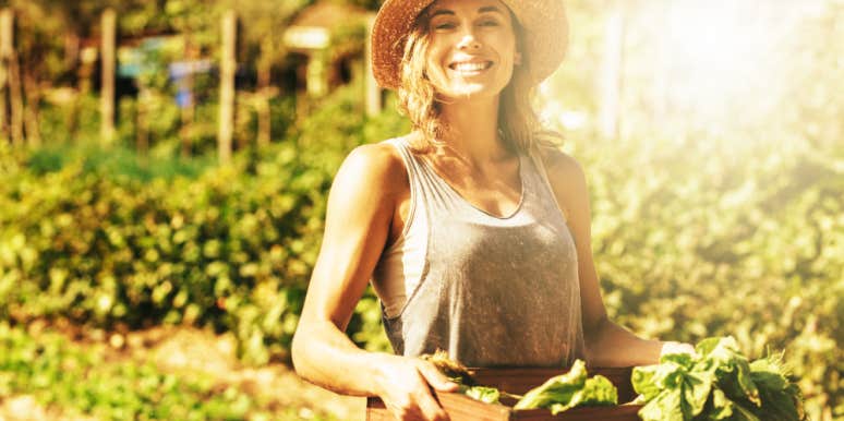 How To Keep Rabbits Out Of Your Garden — 4 Simple Tips Smiling woman with produce harvest from garden