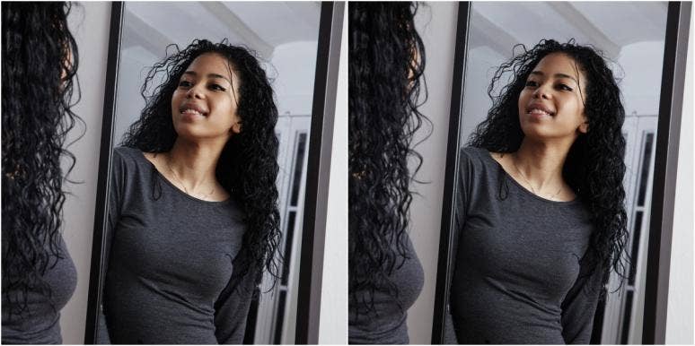 how to love your body woman looking in the mirror