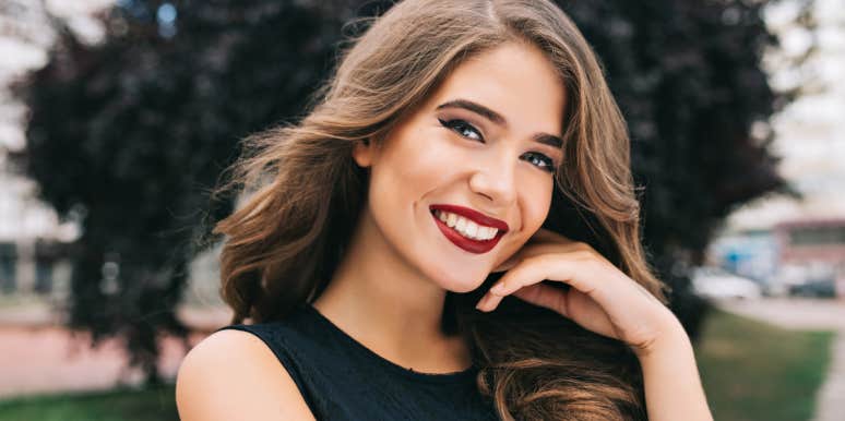 How To Make A Good Impression On A First Date: 12 Simple Tips woman smiling at camera