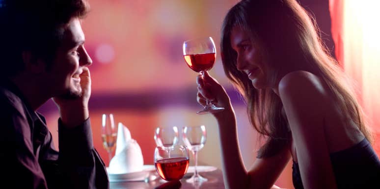 The Easiest Way To Meet Men In Bars — According To Bartenders man and woman flirting at bar